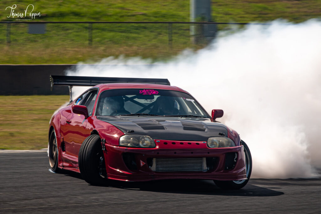 Red Toyota Supra Drifting on track