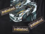 Initiated Sticker - On Shirt